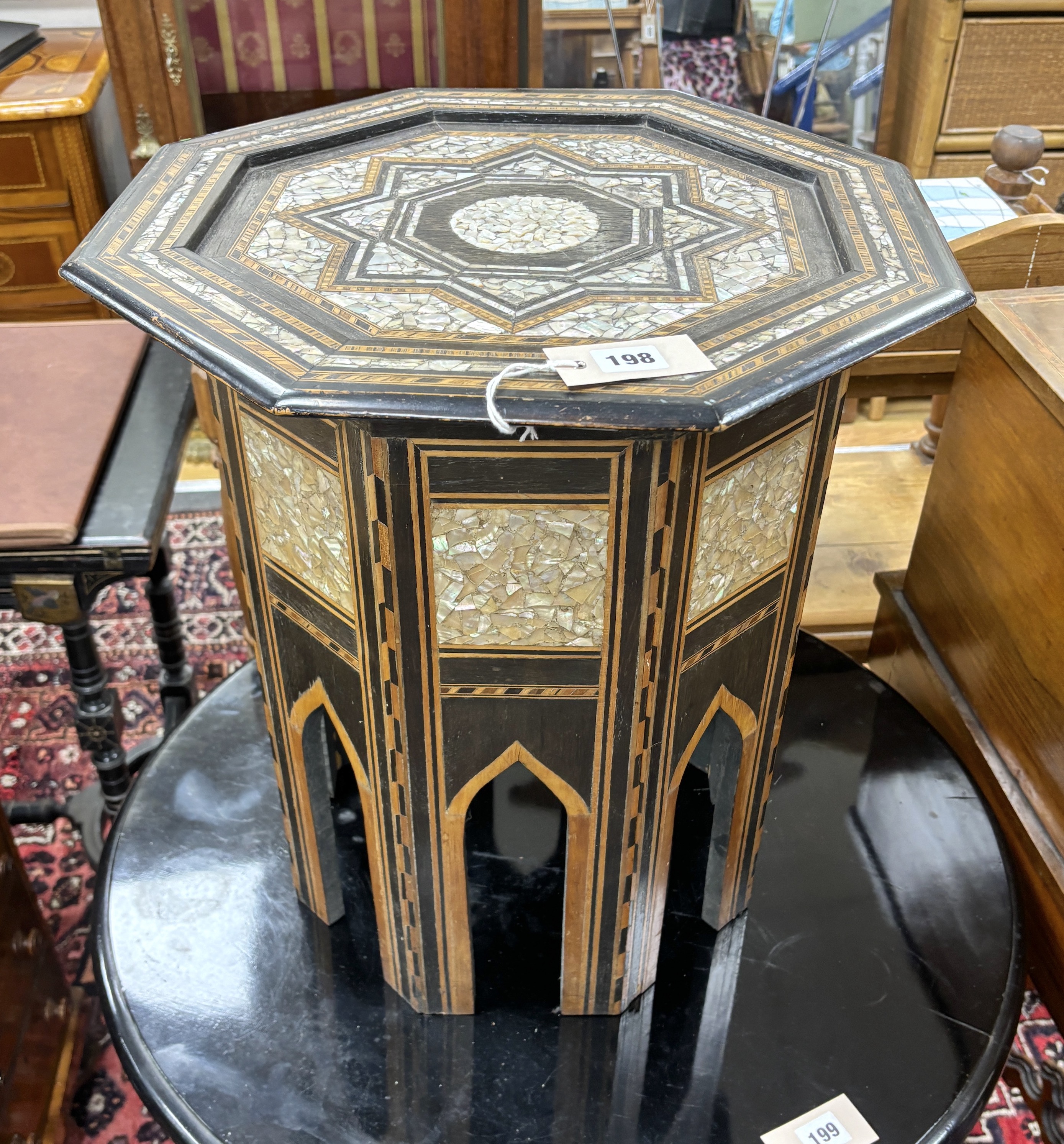 A Moorish octagonal mother of pearl inlaid occasional table, width 46cm, height 51cm
